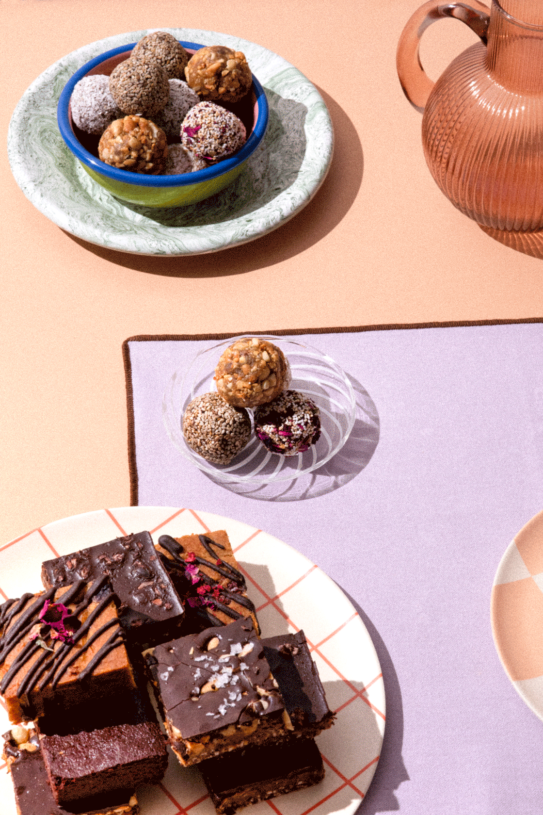 Animated gif of a hand picking up a bliss ball.